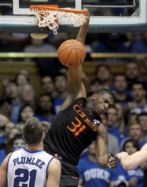 Miami's DeQuan Jones (31) dunks the ball over Duke's Miles Plumlee (21)1. (AP Photo/Sara D. Davis)