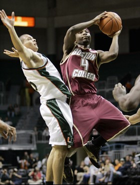 Boston College's Tyrese Rice (4) is fouled by Miami's Denis Clemente in the first half of a college basketball game in Coral Gables, Fla., Wednesday,...