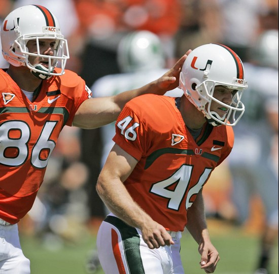 Miami long snapper Ross Abramson, left, congratulates kicker Francesco Zampogna after Zampogna kicked a field goal against Marshall during the first...