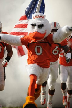 Sebastian the Ibis leads the University of Miami Hurricanes through a tunnel of smoke in a game against the Boston College Eagles at Sun Life Stadium...