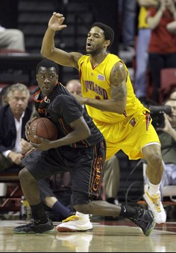 Maryland's Sean Mosley, right, guards Miami's Durand Scott during the first half. (AP Photo/Rob Carr)