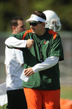 University of Miami Head Coach, Al Golden, instructs his team on how he wants them to execute his game plan during a spring practice at Greentree...