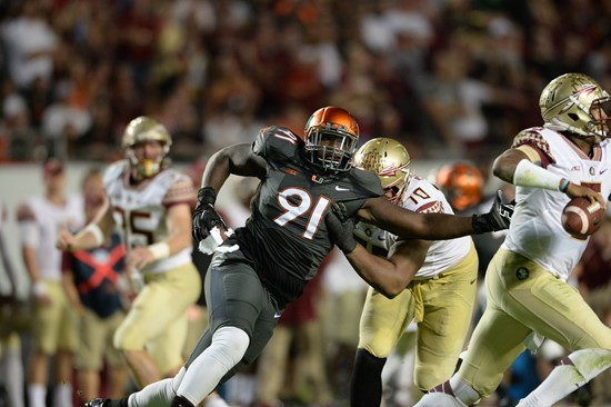 University of Miami Hurricanes defensive lineman Olsen Pierre #91 plays in a game against the Florida State Seminoles at Sun Life Stadium on November...