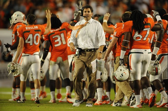 University of Miami Hurricanes head coach Al Golden leads his team on the field in a game against the Boston College Eagles at Sun Life Stadium on...