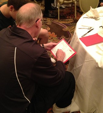 Coach L reads his Christmas card from the team