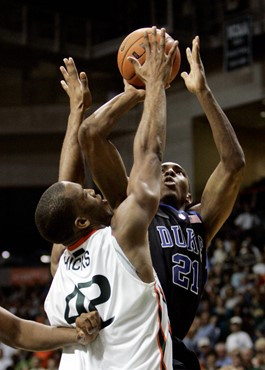 Duke's DeMarcus Nelson (21) prepares to shoot as Miami's Raymond Hicks (42) defends in the second half of a college basketball game in Coral Gables,...