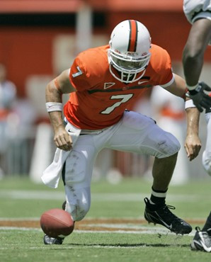 Miami quarterback Kirby Freeman attempts to recover a bobbled snap during the second quarter of a football game against Marshall on Saturday, Sept. 1,...