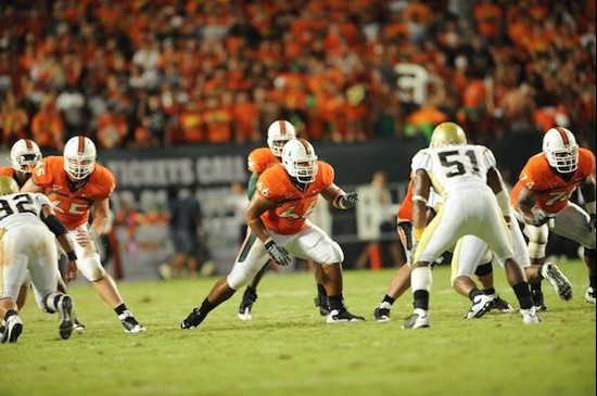 University of Miami Hurricanes offensive lineman Harland Gunn #66 blocks in a game against the Georgia Tech Yellow Jackets at Land Shark Stadium on...