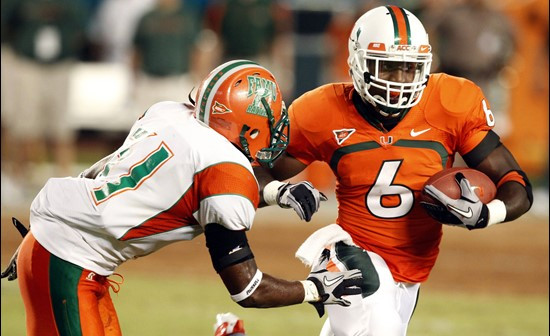 Miami running back Lamar Miller (6) runs for yardage as Florida A&M free safety Gregory Harvey attempts a tackle during the first half of an NCAA...