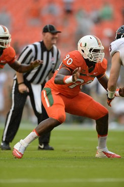 University of Miami Hurricanes defensive lineman Ufomba Kamalu #90 plays in a game against the Virginia Cavaliers at Sun Life Stadium on November 23,...