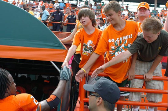 University of Miami running back Derron Thomas #21 shakes hands with fans after a gameagainst Marshall University at the Orange Bowl on September 1,...