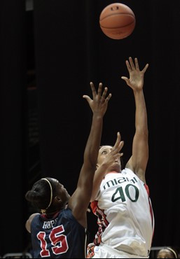 Miami's Shawnice Wilson (40) shoots as Mississippi's Pa'Sonna Hope (15) defends in first the half. (AP Photo/Alan Diaz)