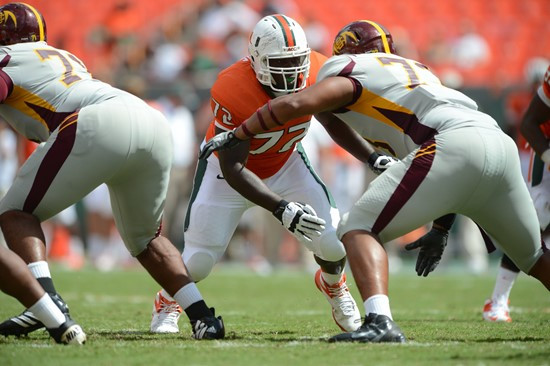 University of Miami Hurricanes defensive lineman Earl Moore #72 plays in a game against the Bethune Cookman Wildcats at Sun Life Stadium on September...