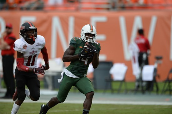 ass from quarterback Brad Kaaya in a game against the Arkansas State Red Wolves at Sun Life Stadium on September13, 2014. Photo by Steven & Matthew...