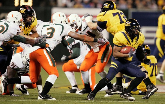 California running back Jahvid Best runs past Miami defenders in the first half of the Emerald Bowl in San Francisco, Saturday, Dec. 27, 2008. (AP...