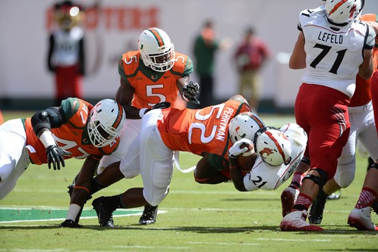 University of Miami Hurricanes linebacker Denzel Perryman #52 plays in a game against the Cincinnati Bearcats at Sun Life Stadium on October 11, 2014....