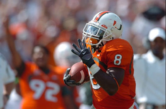 University of Miami wide receiver Darnell Jenkins #8 catches a pass from quarterback Kirby Freeman #7 in a game against the North Carolina State...