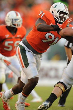 University of Miami Hurricanes defensive lineman Olsen Pierre #91 plays in a game against the Georgia Tech Yellow Jackets at Sun Life Stadium on...