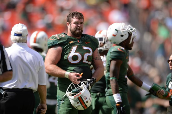 University of Miami Hurricanes offensive lineman Shane McDermott #62 plays in a game against the North Carolina Tar Heels at Sun Life Stadium on...
