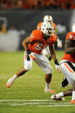 University of Miami Hurricanes linebacker Jordan Futch #58 nearly blocks a punt in a game against the Ohio State Buckeyes at Sun Life Stadium on...