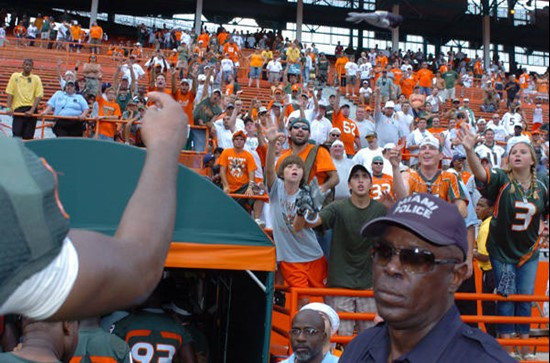 A University of Miami player throws his gloves to fans after a game against the Duke University Blue Devils at the Orange Bowl on September 29, 2007. ...