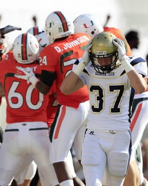 Georgia Tech running back Zach Laskey (37) reacts after Miami defensive back JoJo Nicolas scored following Laskey's fumbled punt return. (AP...