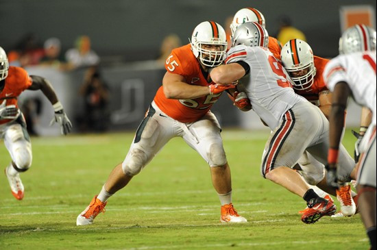 University of Miami Hurricanes offensive lineman Brandon Linder #65 gets set to block in a game against the Ohio State Buckeyes at Sun Life Stadium on...