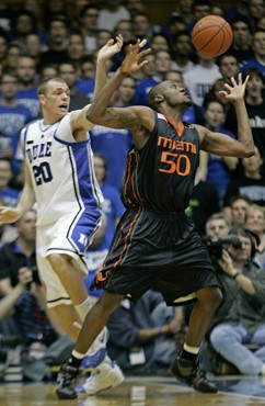 Duke's Taylor King (20) and Miami's Anthony King (50) battle for a rebound during the first half of a college basketball game in Durham, N.C.,...