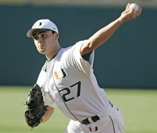 Miami starting pitcher Chris Hernandez delivers against Georgia in the second inning of an NCAA College World Series baseball game, in Omaha, Neb.,...