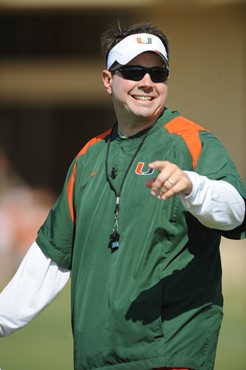 University of Miami Head Coach, Al Golden, instructs his team on how he wants them to execute his game plan during a spring practice at Greentree...