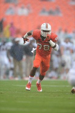 University of Miami Hurricanes defensive end Al-Quadin Muhammad #98 plays in a game against the Virginia Cavaliers at Sun Life Stadium on November 23,...