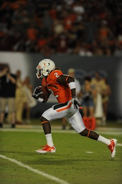 University of Miami Hurricanes running back Graig Cooper #2 carries the ball in a game against the Florida State Seminoles at Sun Life Stadium on...
