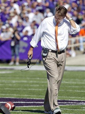 Miami coach Al Golden walks off the field after checking on an injured player during the first half of an NCAA football game against Kansas State in...
