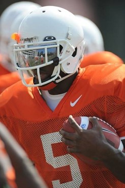 University of Miami Hurricanes running back Mike James #5 rushes at Greentree Practice Field on August 13 in afternoon drills to prepare for the...