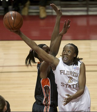 Miami's Riquana Williams, right, drives past Florida State's Alysha Harvin during the first half of an NCAA college basketball game Thursday, Feb. 25,...