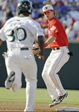Georgia short stop Gordon Beckham, right, prepares to throw to first base for a double play after forcing out Miami's Adan Severino, left, in the...