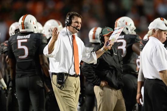 University of Miami Hurricanes head coach Al Golden leads his team on the field in a game against the Duke Blue Devils at Sun Life Stadium on...