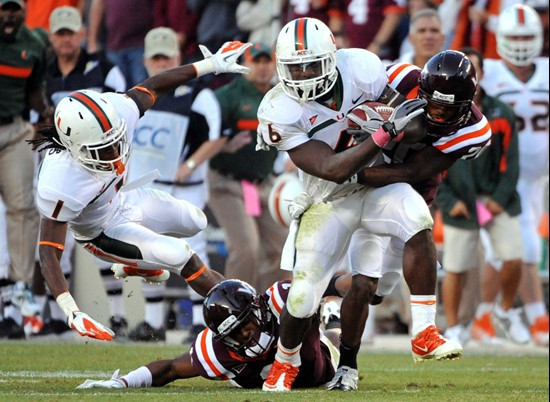 Miami's Lamar Miller, (6) runs the ball against Virginia Tech defensivemen during the second half of an NCAA college football game Saturday, Oct. 8,...