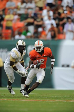 University of Miami Hurricanes running back Graig Cooper #2 runs for a first down in a game against the University of Central Florida Knights at...