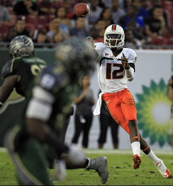 Jacory Harris throws a pass against South Florida. (AP Photo/Chris O'Meara)