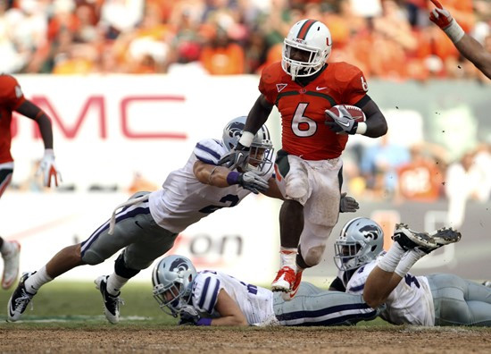 Miami's Lamar Miller (6) outruns Kansas State's Tysyn Hartman (2) for a touchdown. Kansas State defeated Miami 28-24. (AP Photo/J Pat Carter)