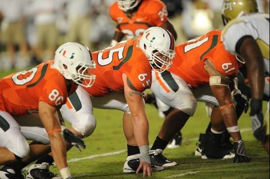 University of Miami Hurricanes offensive lineman Matt Pipho #65 gets set to block in a game against the Georgia Tech Yellow Jackets at Land Shark...