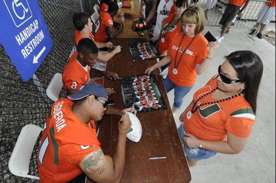 Joel Figueroa & Tommy Streeter sign autographs before the 2011 Miami Hurricanes Spring Football @ Lockhart Stadium