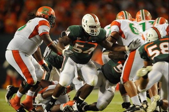 University of Miami Hurricanes defensive lineman Micanor Reqis #54 plays in a game against the Florida A&M Rattlers at Land Shark Stadium on October...