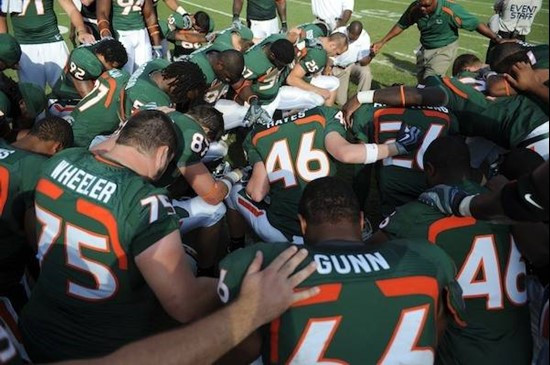 University of Miami Hurricane players meet at the 50 yard line in a moment of unity after a winning game against the Duke Blue Devils at Land Shark...