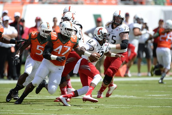 University of Miami Hurricanes linebacker Akil Craig #47 plays in a game against the Cincinnati Bearcats at Sun Life Stadium on October 11, 2014.   ...