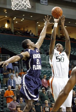 Anthony King (50) shoots for the basket with North Florida center Dwayne Collins defending during the first half of a college basketball game in...
