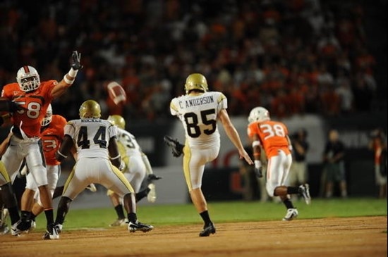 University of Miami Hurricanes linebacker Jordan Futch #58 attempts to block a punt against the Georgia Tech Yellow Jackets at Land Shark Stadium on...