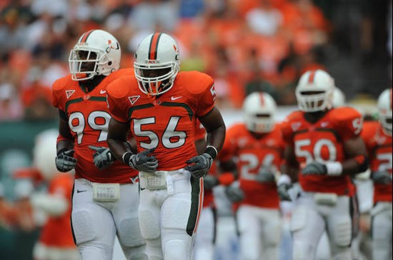 University of Miami Hurricanes linebacker Marcus Robinson #56 leads his team back to the sideline in a game against the University of Central Florida...