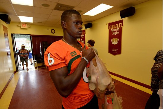 Herb Waters helps unload bags at Greater Mercy Missionary Baptist Church.